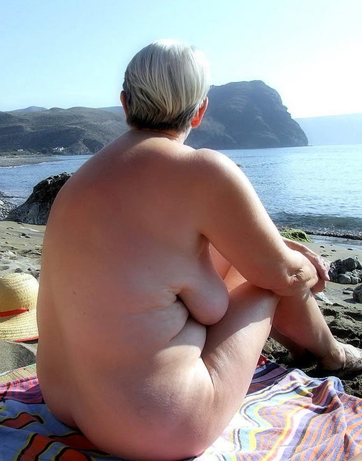 Naked mature fat people on the beach