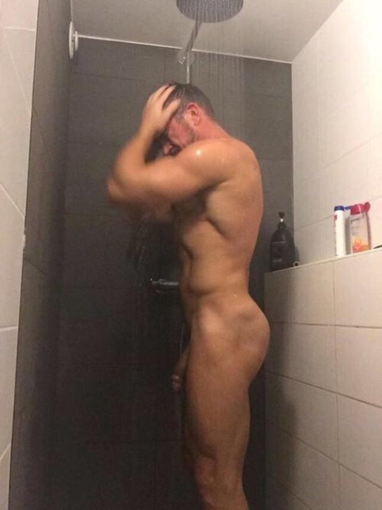 Naked guys wash in the shower
