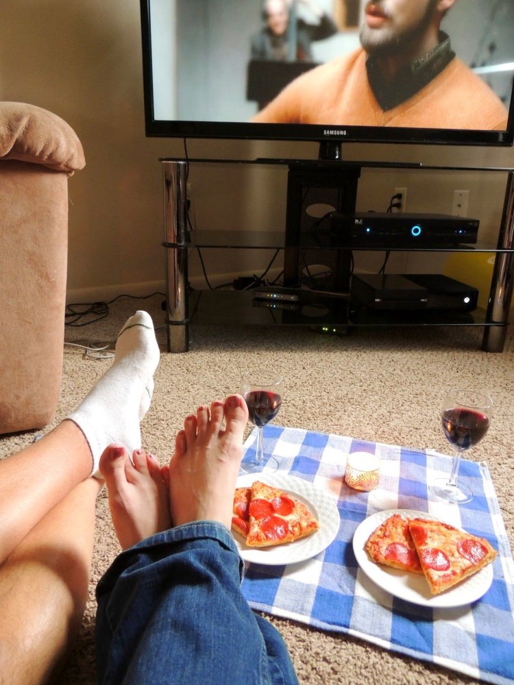 Legs in front of the TV
