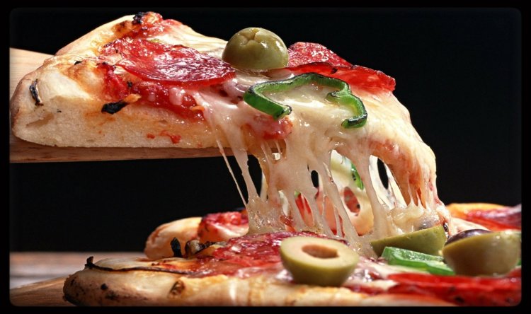 Pizza piece in the mouth