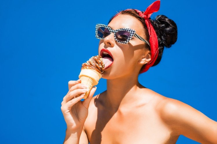 The girl eats ice cream