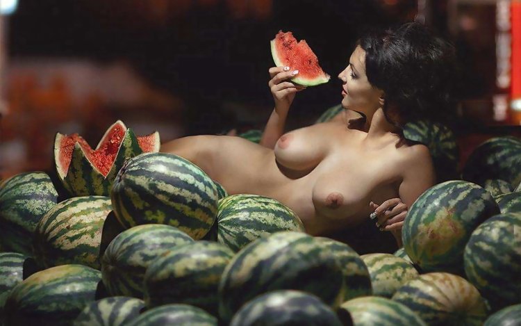 Several naked woman with watermelon