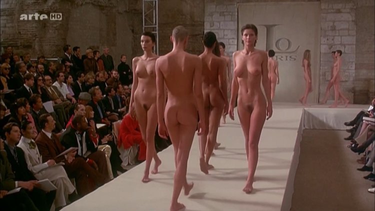 Naked women walk on the podium
