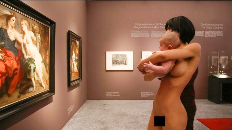 Girl undressed at the exhibition