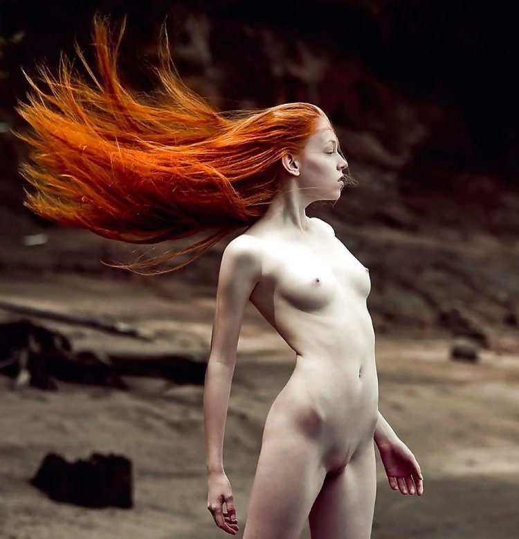 Red -haired girl with long hair nude