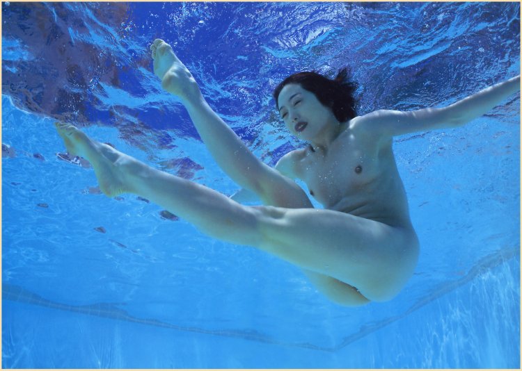 Naked women jump into the pool