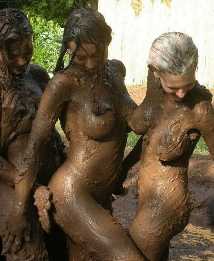Naked girls bathed in mud
