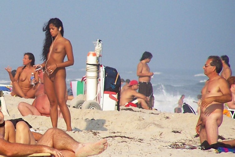Naked men sunbathe on the beach