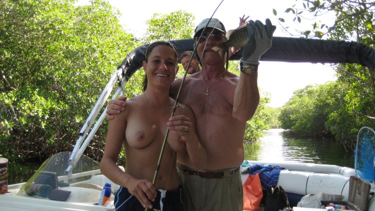 Mature naked women on a boat