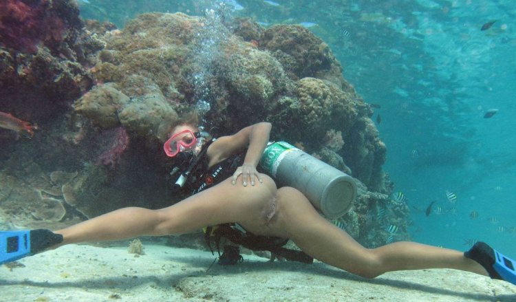 Naked with scuba dummy underwater