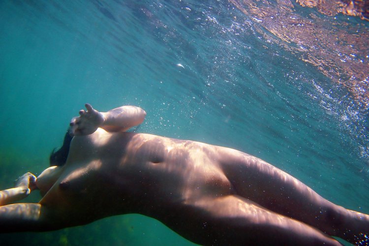 Naked girls in water