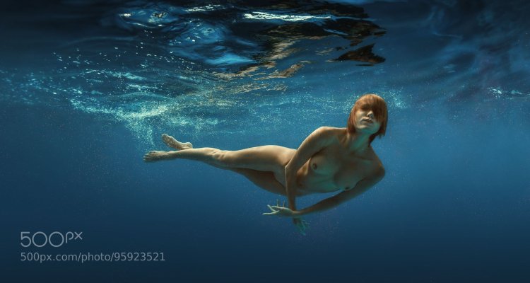 Naked women jump into the pool