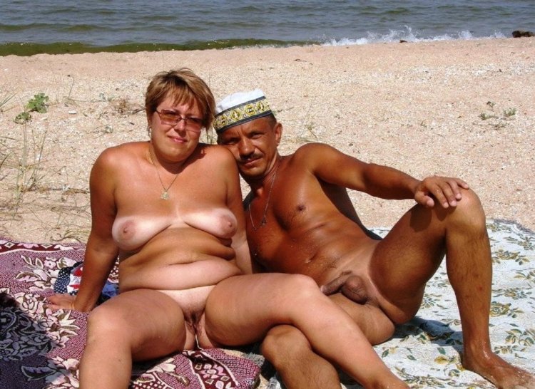 Mothers with daughters naked on the beach