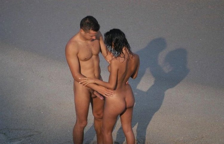 Naked girls with guys on the beach