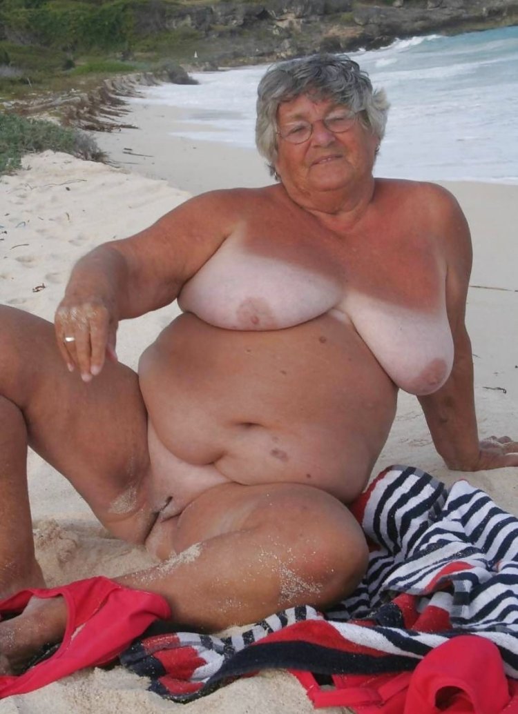 Old women fat on the beach