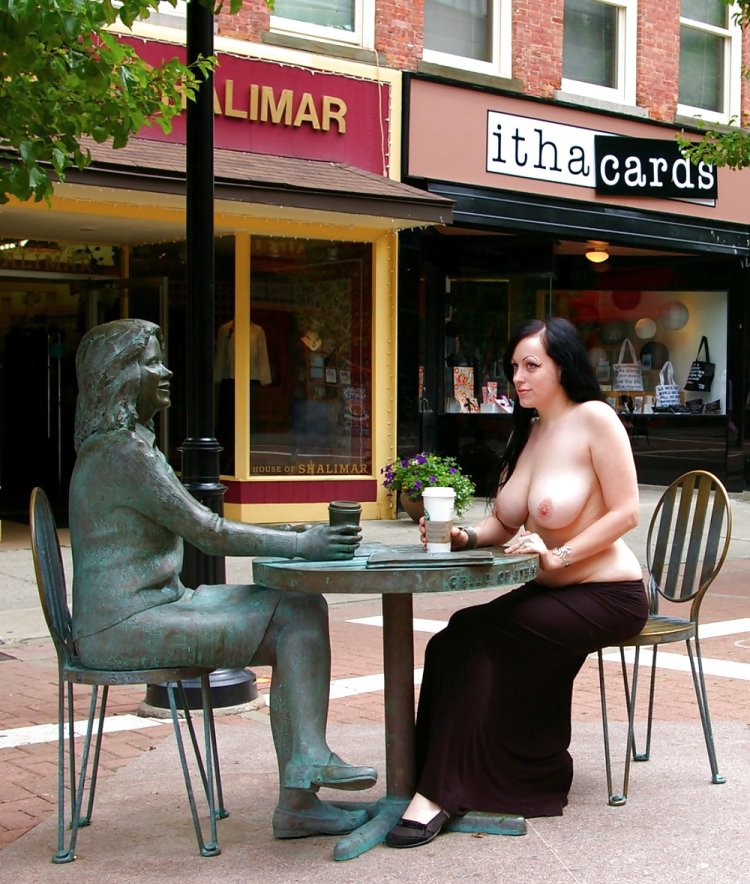 Round chest naked in a cafe